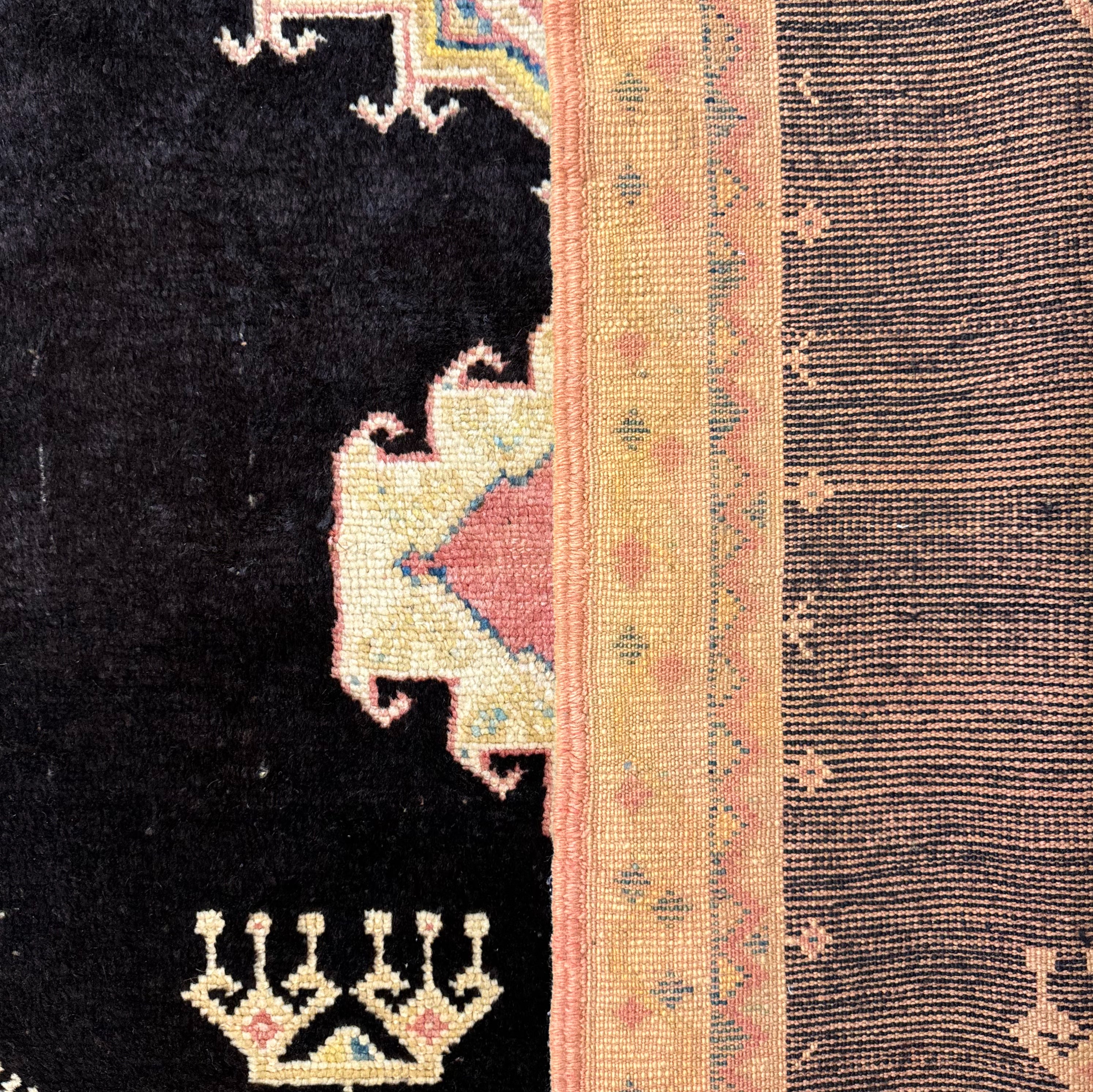 Close-up of a textured fabric with intricate patterns and colors.