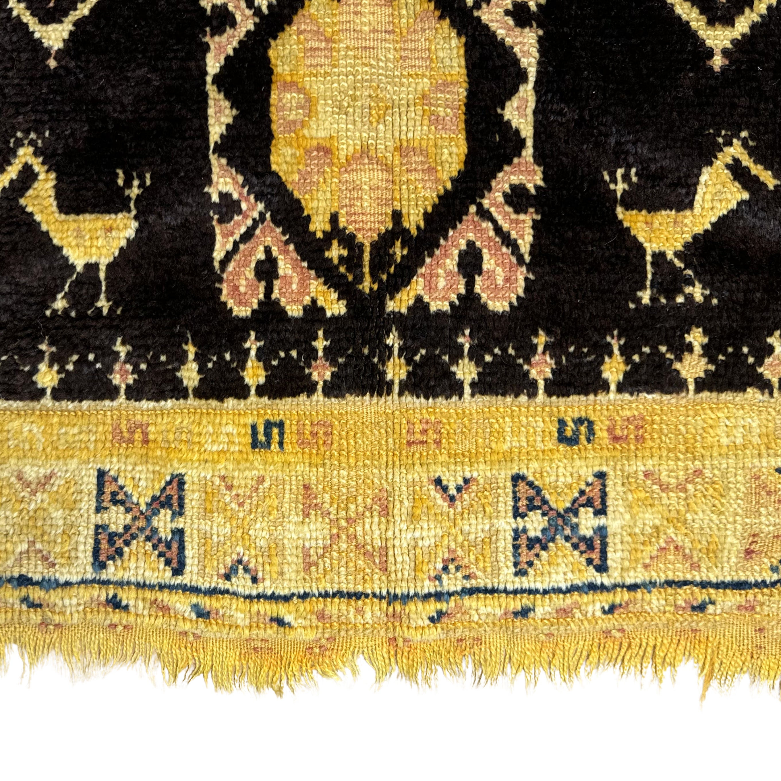 Close-up of a patterned fabric with yellow and black design