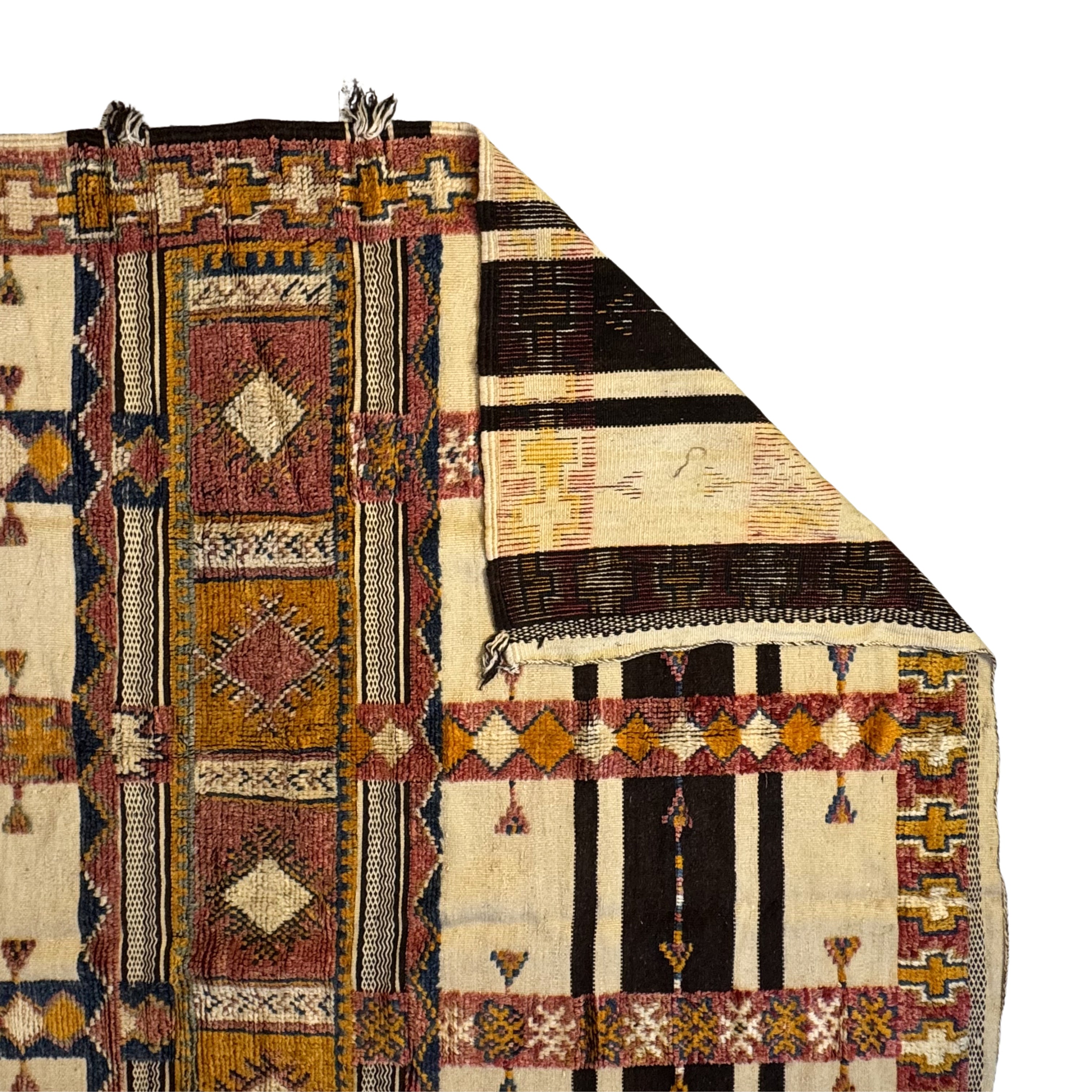Multicolored patterned rug with geometric designs on a white background
